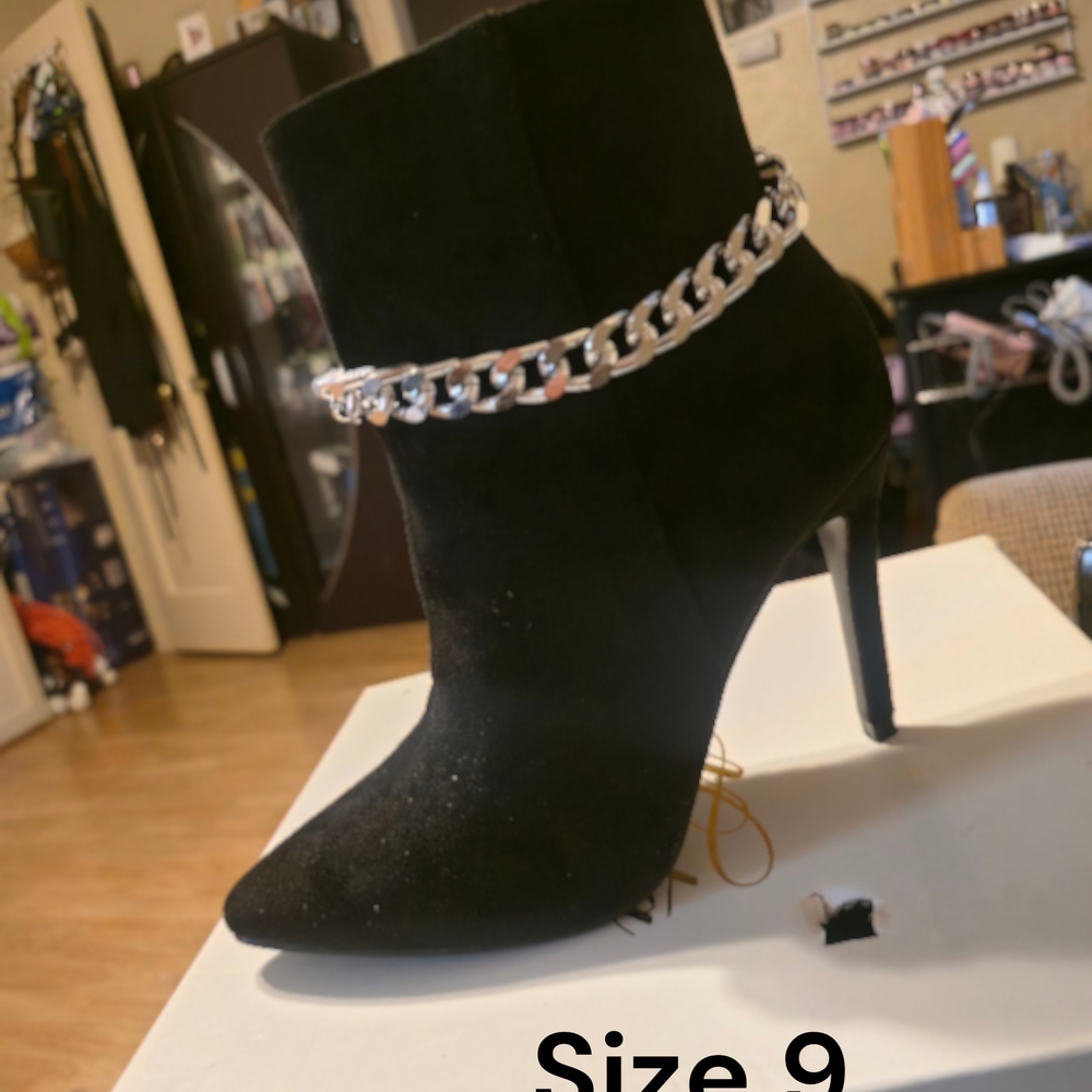 Chic Black Heeled Boots with Silver Chain Accent